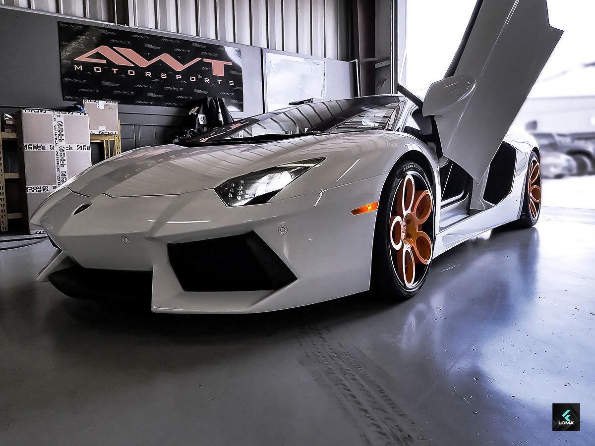 Innovative 3-piece wheels design by LOMA Forged™ on a Lamborghini Aventador, merging style and road performance.